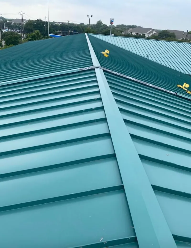 Green commercial metal roof ridge and valley for Metal Roof Repair in Manchester